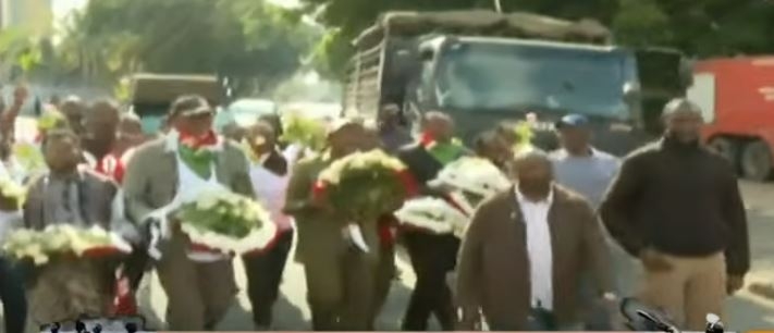 Opposition leaders lay wreaths on Parliament Road